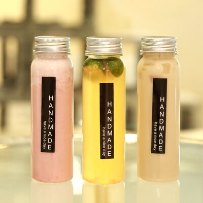 Leak proof Milk Tea Bottles Plastic Screw on Lid Durable Reusable Containers Ideal for Beverage Packaging and Storage