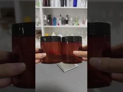 กระปุกเครื่องสำอางพลาสติกเปล่าหรูหราแบบกำหนดเองขายส่งพร้อมฝาปิด